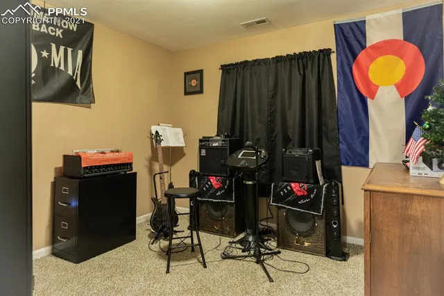 a view of a livingroom with furniture and staircase