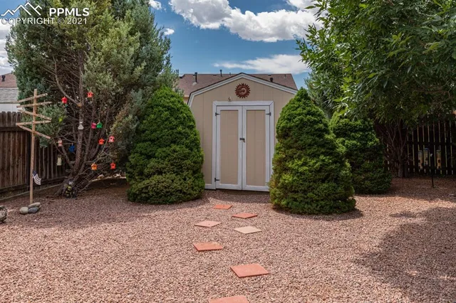 a house view with a sitting space and garden