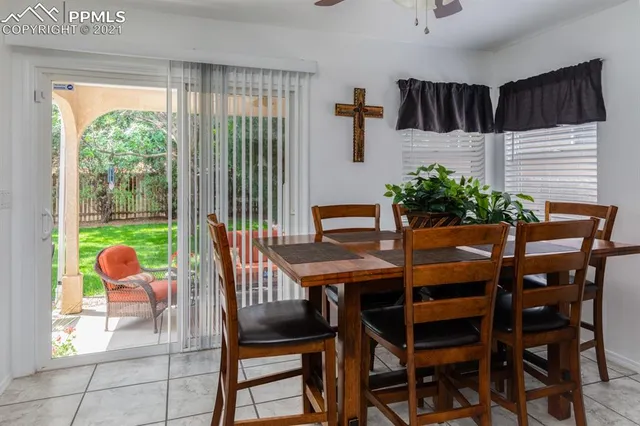 a view of a dining room with furniture and window in a room