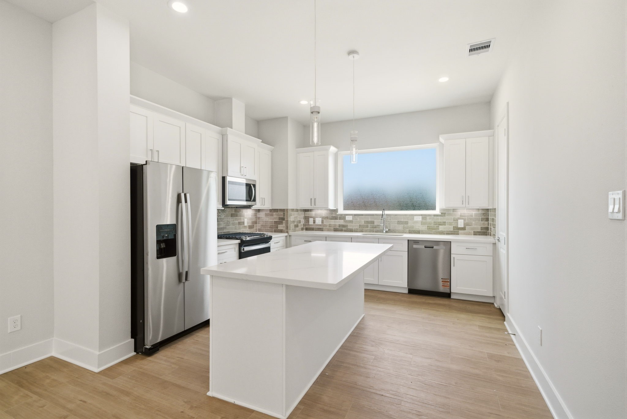 1398 Cedar Post Lane Houston, TX 77080 - Photo 15 of 33 a large kitchen with a sink refrigerator and cabinets