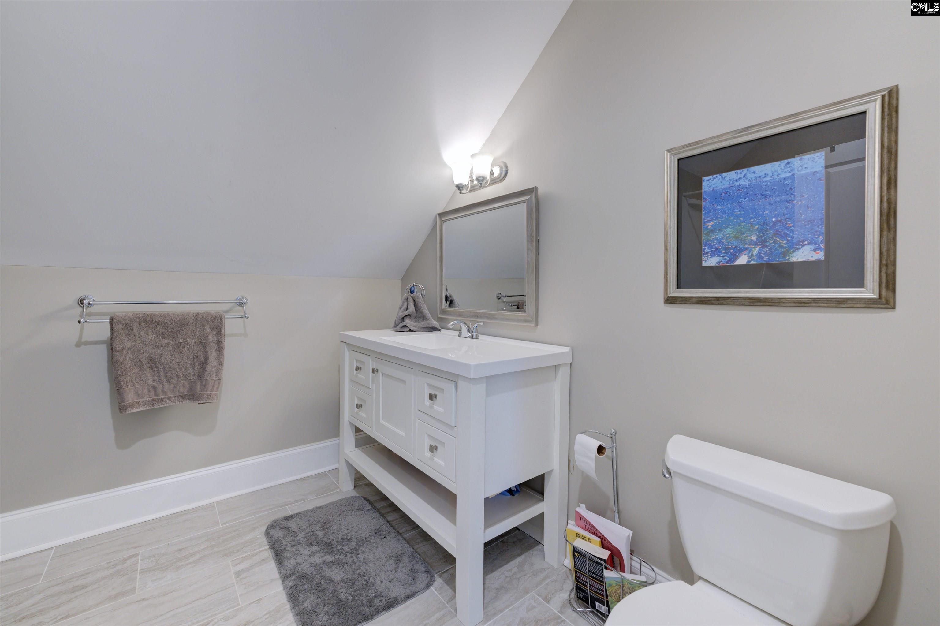305 Northlake Road Columbia, SC 29223 - Photo 37 of 46 a bathroom with a toilet sink and mirror