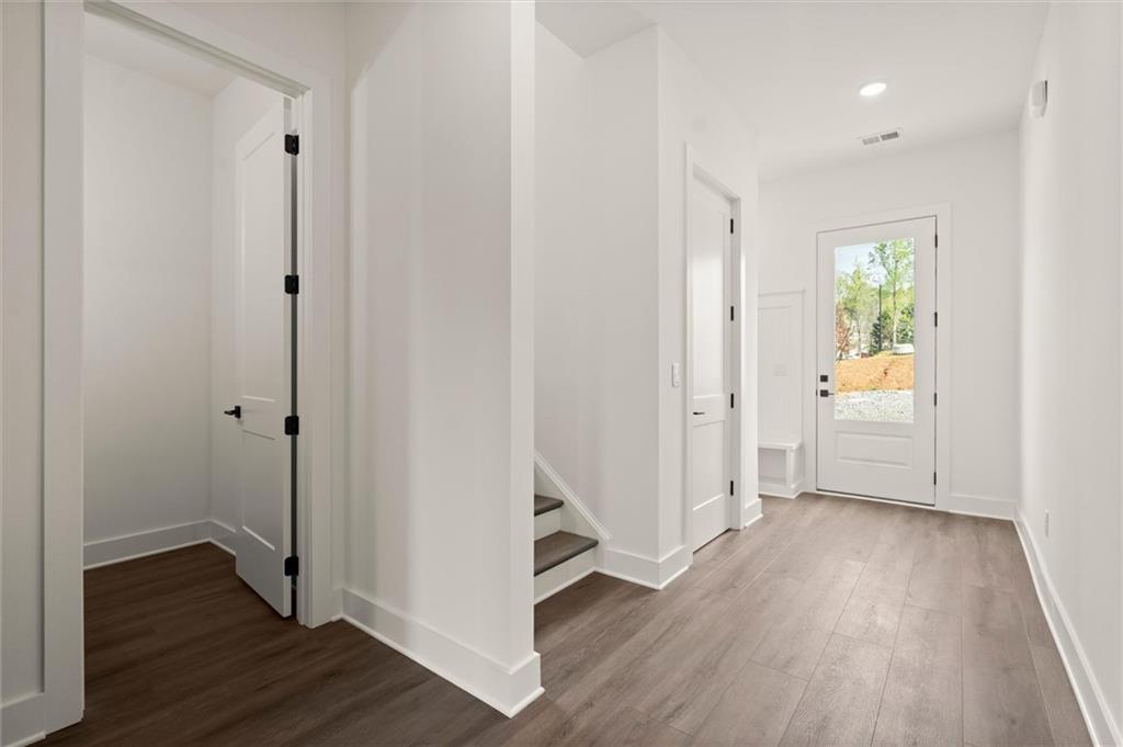 322 Treble Way Alpharetta, GA 30009 - Photo 18 of 67 a view of an empty room with wooden floor and a window