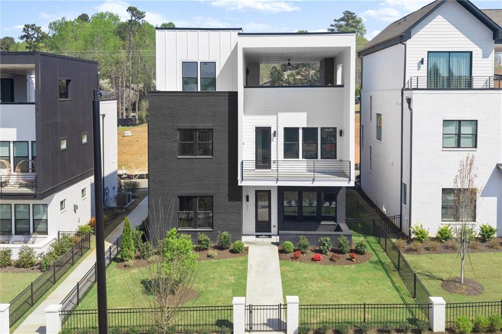 322 Treble Way Alpharetta, GA 30009 - Photo 2 of 67 a front view of a house with garden