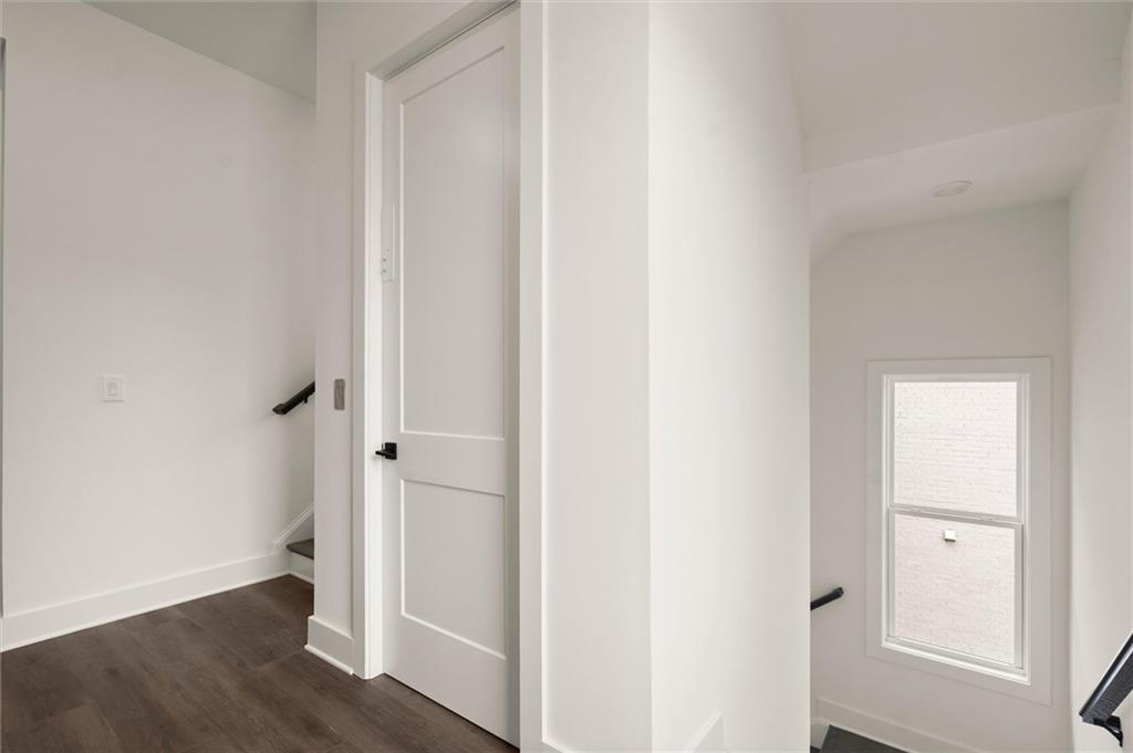322 Treble Way Alpharetta, GA 30009 - Photo 23 of 67 a view of a hallway with wooden floor