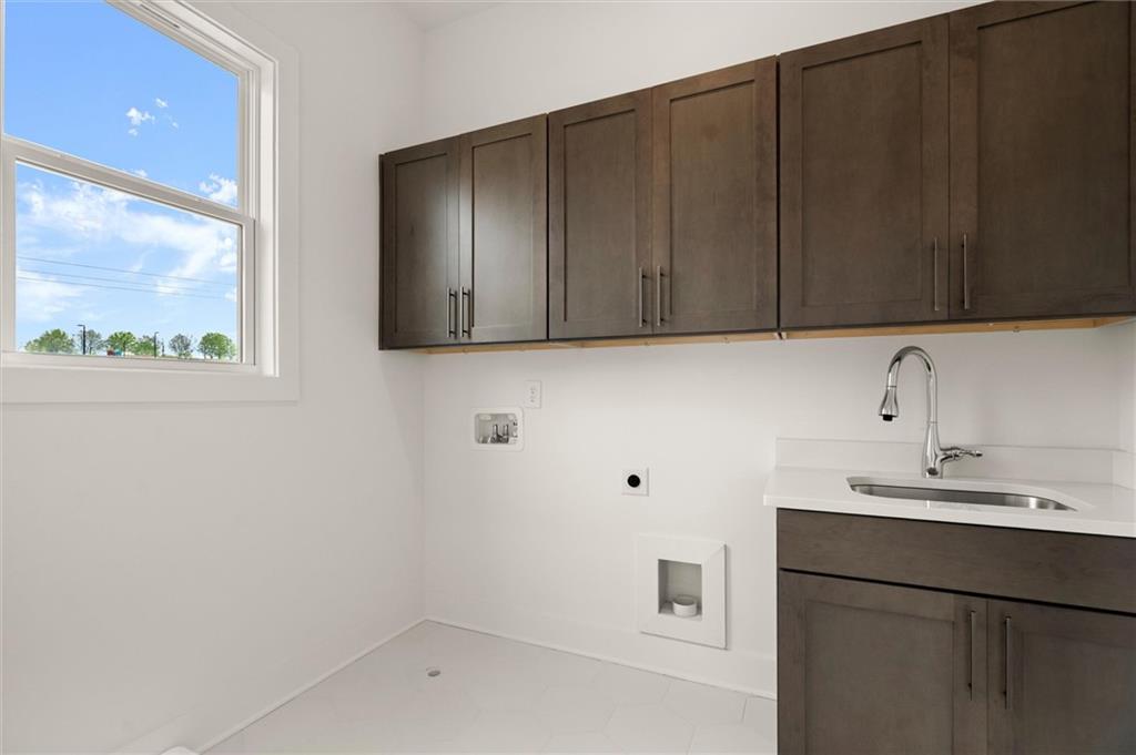 322 Treble Way Alpharetta, GA 30009 - Photo 24 of 67 a bathroom with a sink and a window