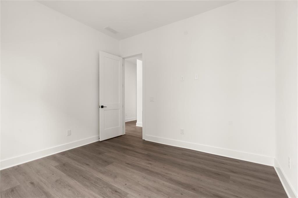 322 Treble Way Alpharetta, GA 30009 - Photo 28 of 67 a view of an empty room with wooden floor