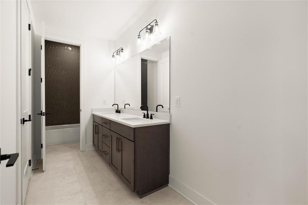 322 Treble Way Alpharetta, GA 30009 - Photo 29 of 67 a bathroom with a sink and a mirror