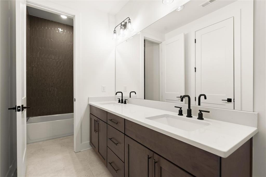 322 Treble Way Alpharetta, GA 30009 - Photo 30 of 67 a bathroom with a sink and a mirror