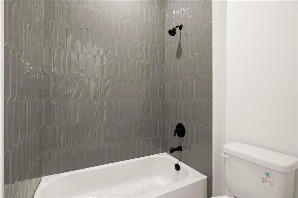 322 Treble Way Alpharetta, GA 30009 - Photo 31 of 67 a bathroom with a white bath tub and a shower