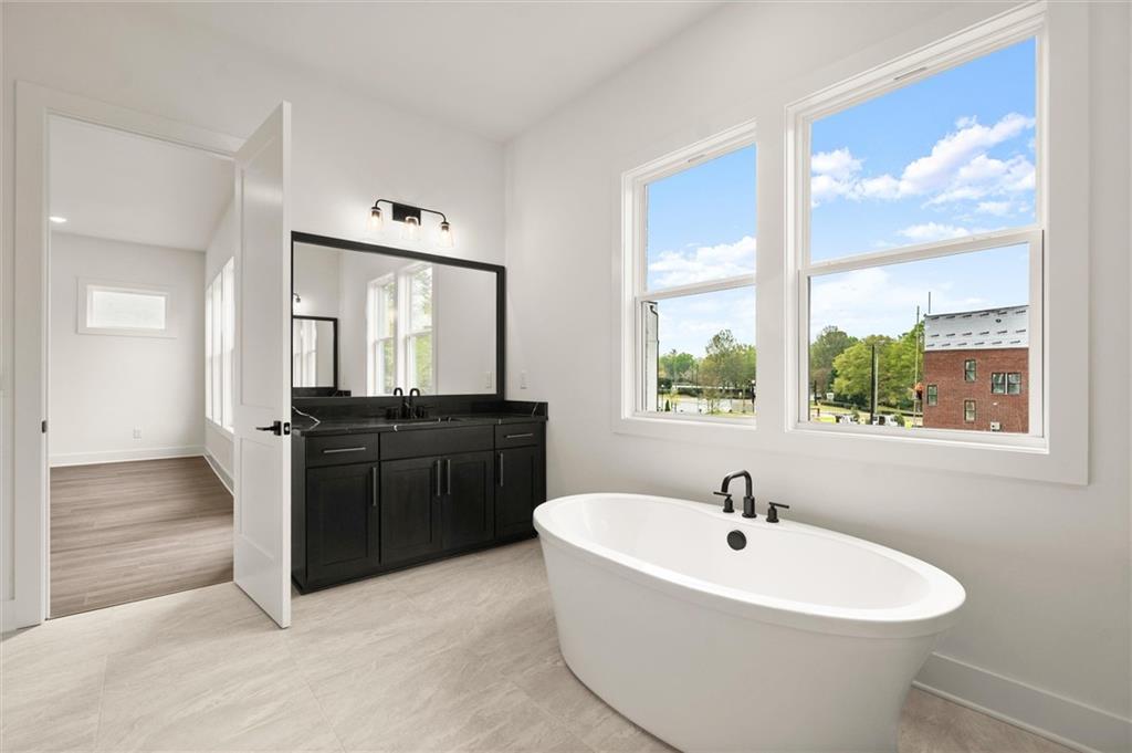 322 Treble Way Alpharetta, GA 30009 - Photo 33 of 67 a bathroom with a bathtub and a sink