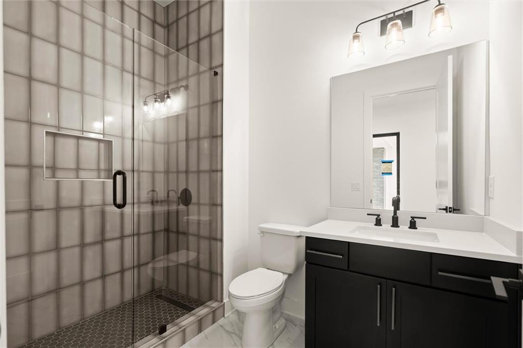 322 Treble Way Alpharetta, GA 30009 - Photo 39 of 67 a bathroom with a sink toilet and shower