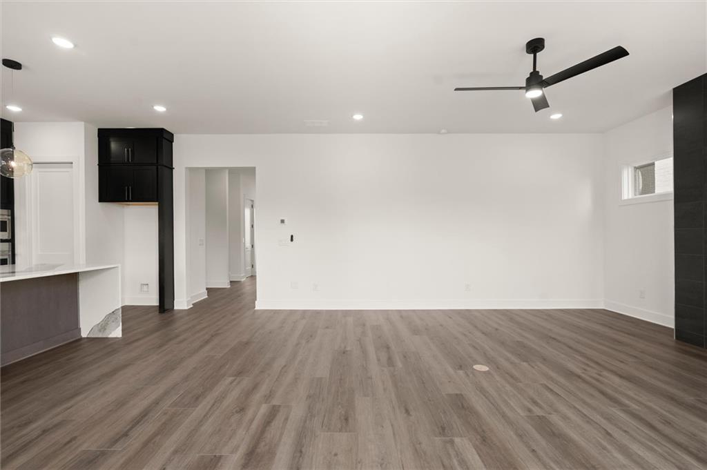 322 Treble Way Alpharetta, GA 30009 - Photo 4 of 67 a view of an empty room with wooden floor and a window