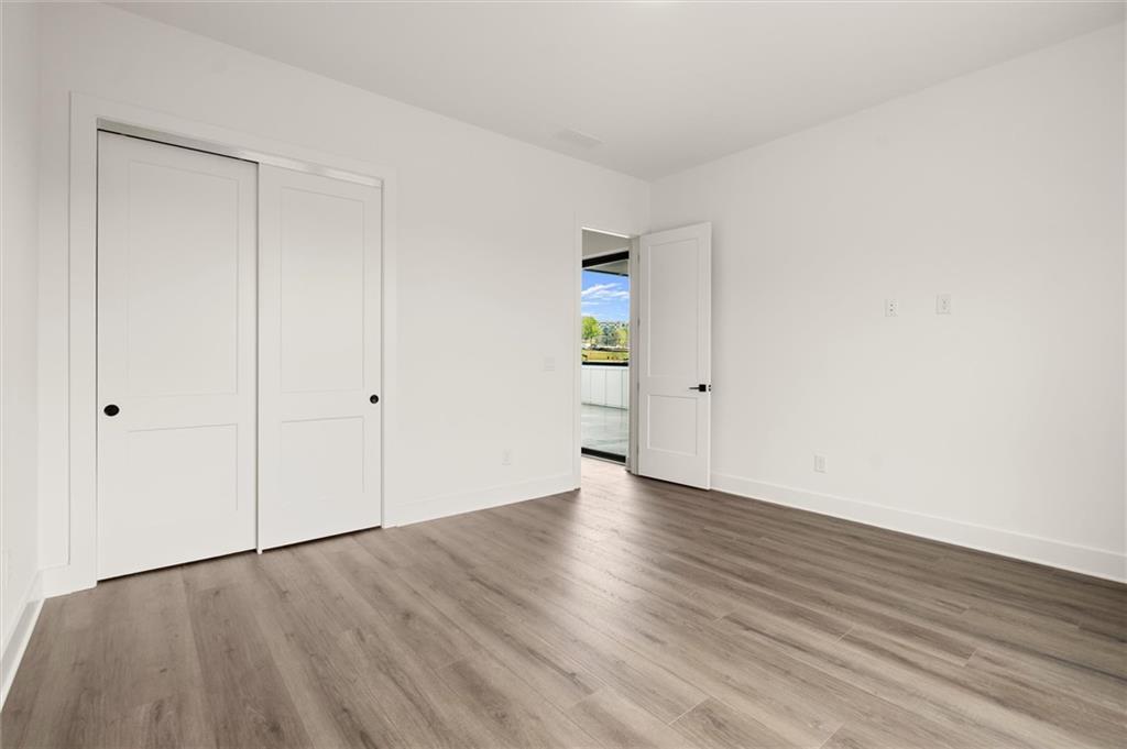 322 Treble Way Alpharetta, GA 30009 - Photo 41 of 67 a view of an empty room with wooden floor