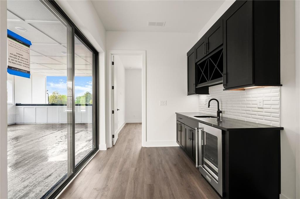 322 Treble Way Alpharetta, GA 30009 - Photo 48 of 67 a kitchen with stainless steel appliances granite countertop a stove and a sink