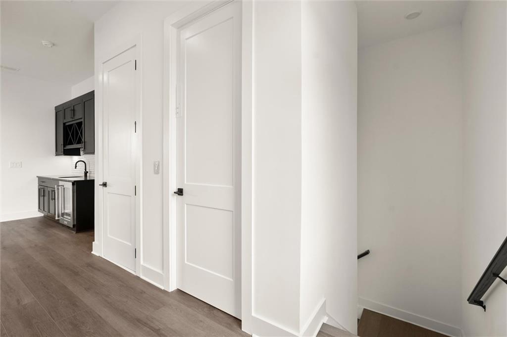 322 Treble Way Alpharetta, GA 30009 - Photo 49 of 67 a view of hallway with livingroom and wooden floor