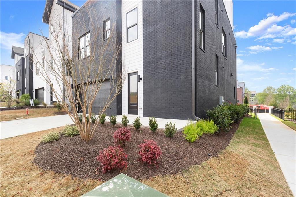322 Treble Way Alpharetta, GA 30009 - Photo 51 of 67 a view of a pathway with a garden