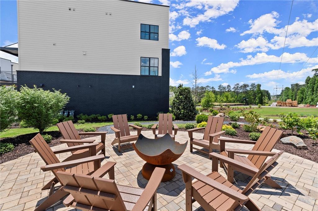 322 Treble Way Alpharetta, GA 30009 - Photo 57 of 67 a view of a patio with chairs and a table