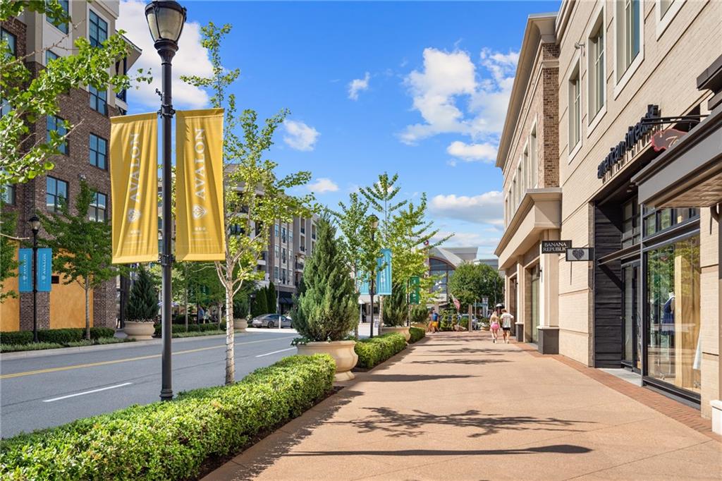 322 Treble Way Alpharetta, GA 30009 - Photo 65 of 67 a view of a building with a tree in front