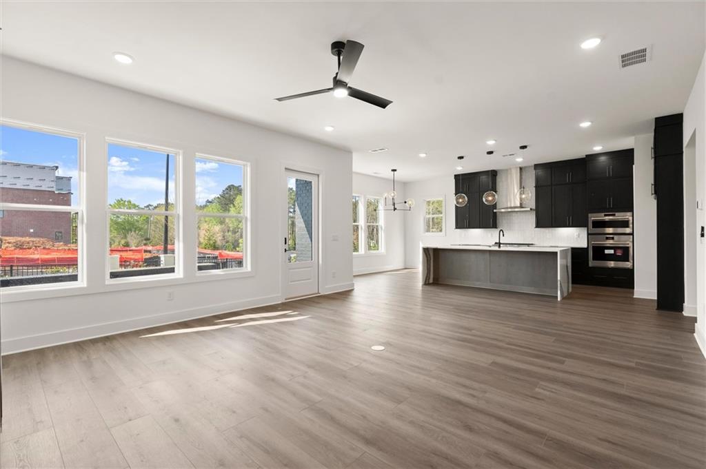322 Treble Way Alpharetta, GA 30009 - Photo 7 of 67 a view of kitchen with cabinets and wooden floor