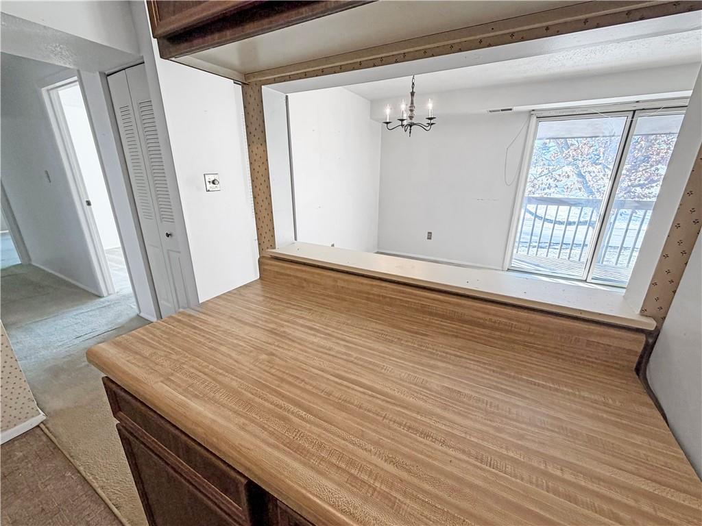2467 Brook Ledge Road, Unit 34B Bridgeville, PA 15017 - Photo 10 of 19 a view of an empty room with wooden floor and a window