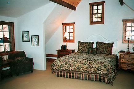 8 Altamira Ranch Road Basalt, CO 81621 - Photo 6 of 8 a bedroom with a bed and dresser with window