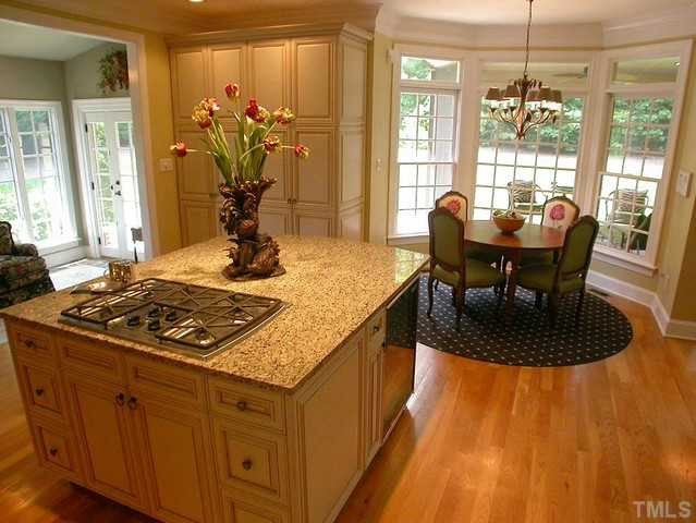 1528 Tradescant Court Raleigh, NC 27613 - Photo 11 of 25 View of island and breakfast area in gourmet kitchen with hardwood floors. Kitchen