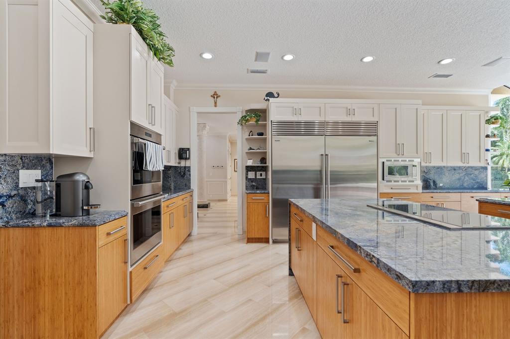 14641 Mustang Trail Southwest Ranches, FL 33330 - Photo 36 of 94 a large kitchen with stainless steel appliances granite countertop a lot of counter space and a sink