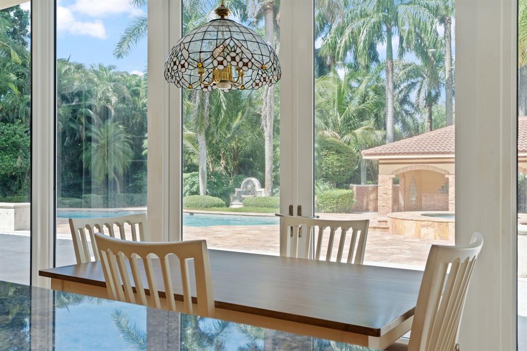 14641 Mustang Trail Southwest Ranches, FL 33330 - Photo 38 of 94 a view of a dining room with furniture window and outside view