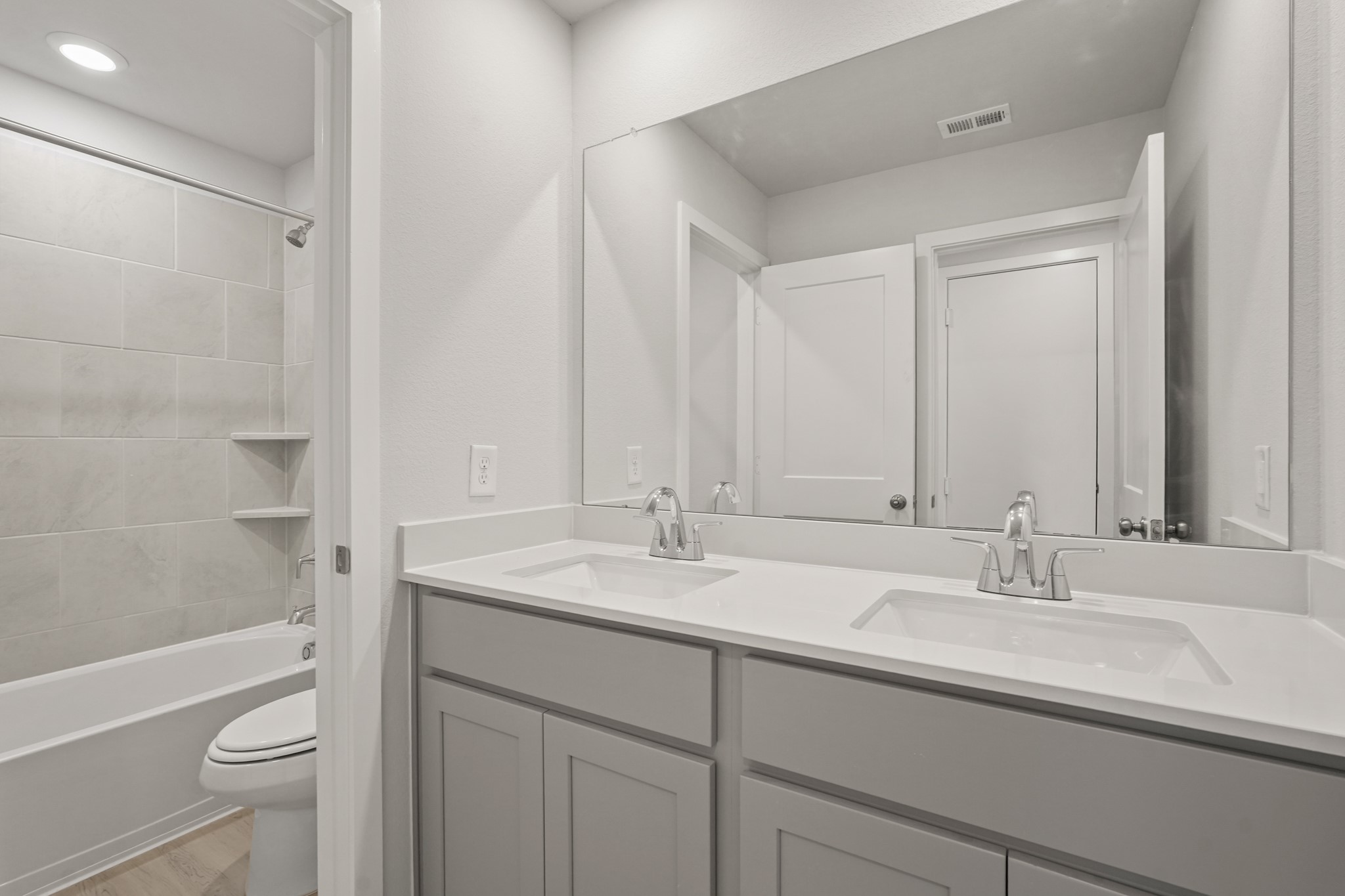 217 Spring Drive Hockley, TX 77447 - Photo 18 of 27 a bathroom with a sink a toilet and shower