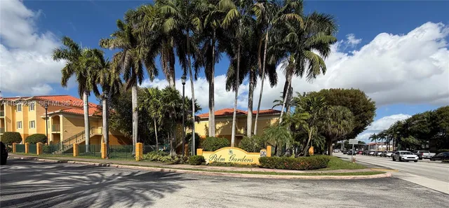 a view of a park with palm trees