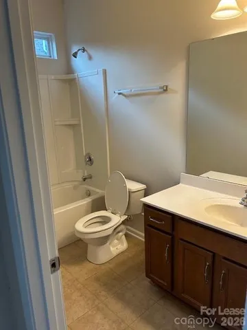 a bathroom with a toilet a sink and bathtub