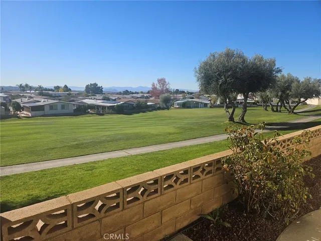 a view of a golf course with a lake