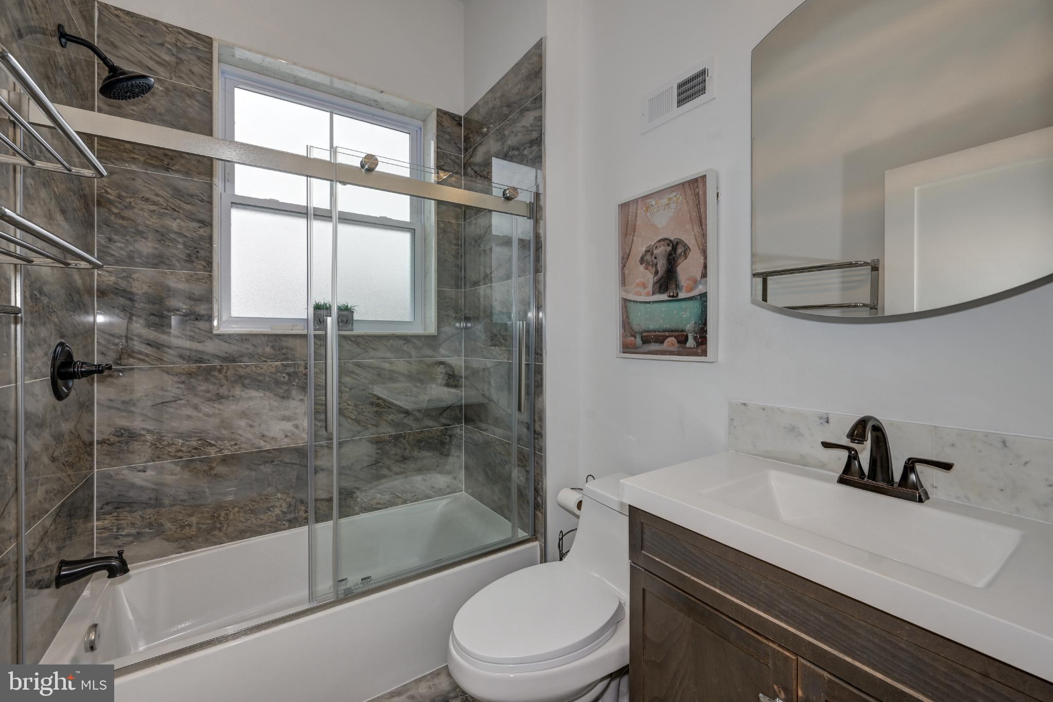 144 Hurffville Grenloch Road Sewell, NJ 08080 - Photo 21 of 50 a bathroom with a sink a toilet and a shower