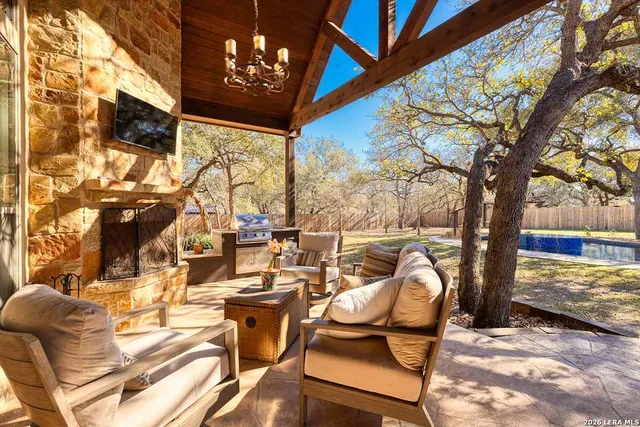 a view of a chairs and table in patio