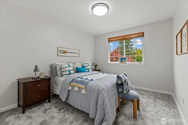 a bed room with a bed and a window