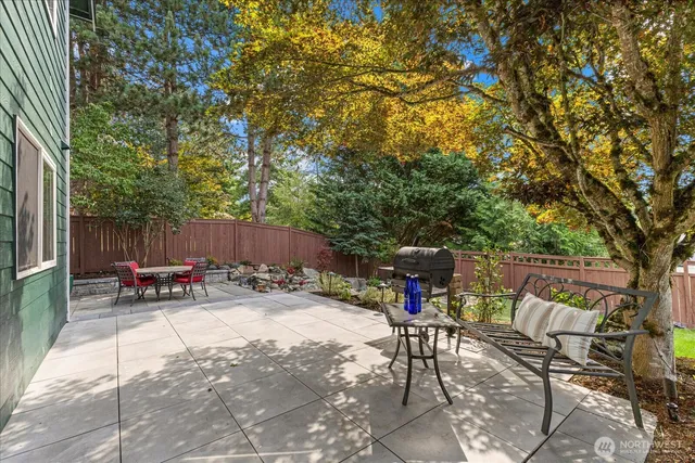 an outdoor space with furniture and umbrella