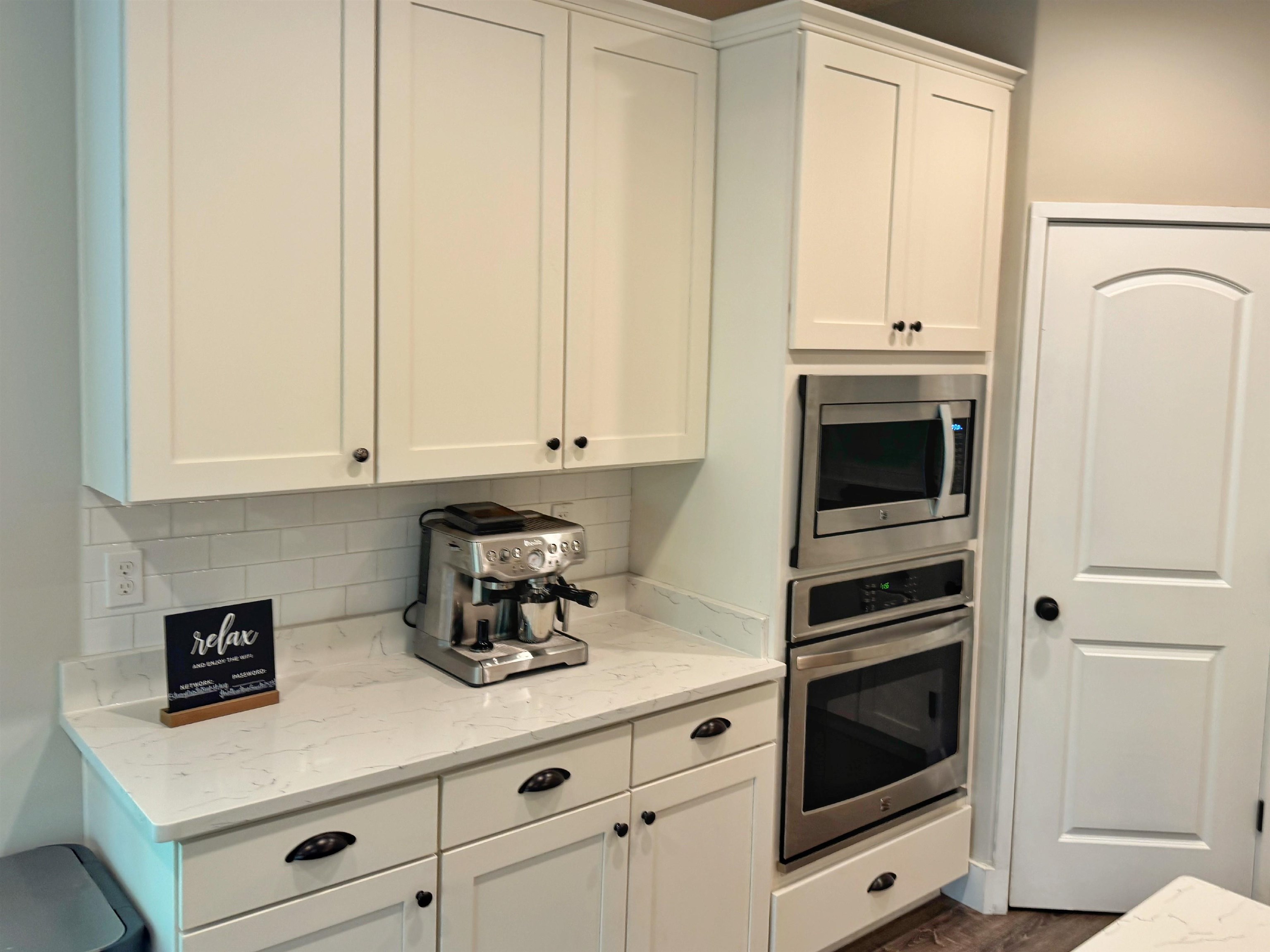 2523 Oleander Street St. Augustine, FL 32080 - Photo 13 of 54 a kitchen with granite countertop white cabinets and white appliances