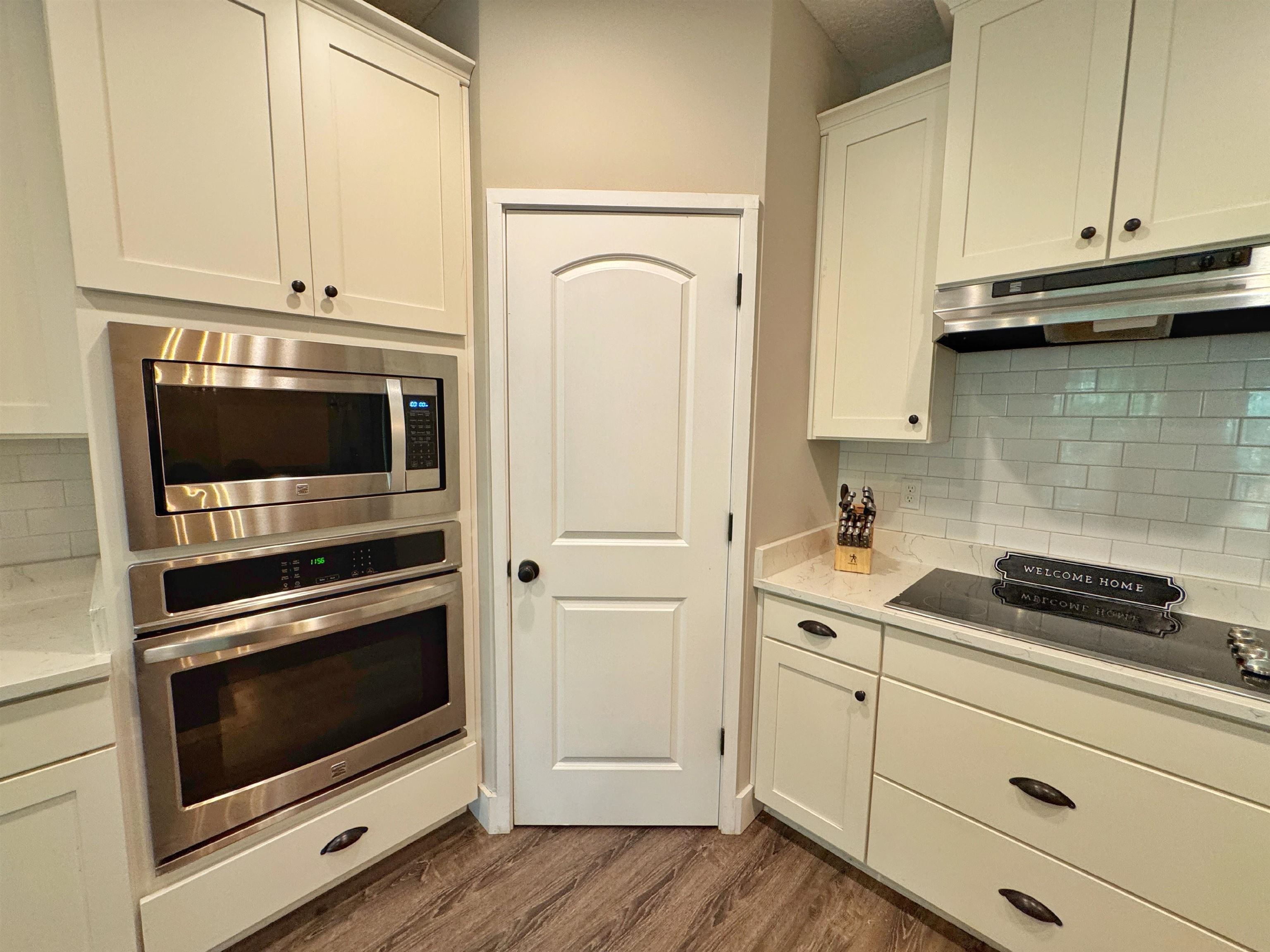 2523 Oleander Street St. Augustine, FL 32080 - Photo 20 of 54 a kitchen with granite countertop cabinets stainless steel appliances and wooden floor