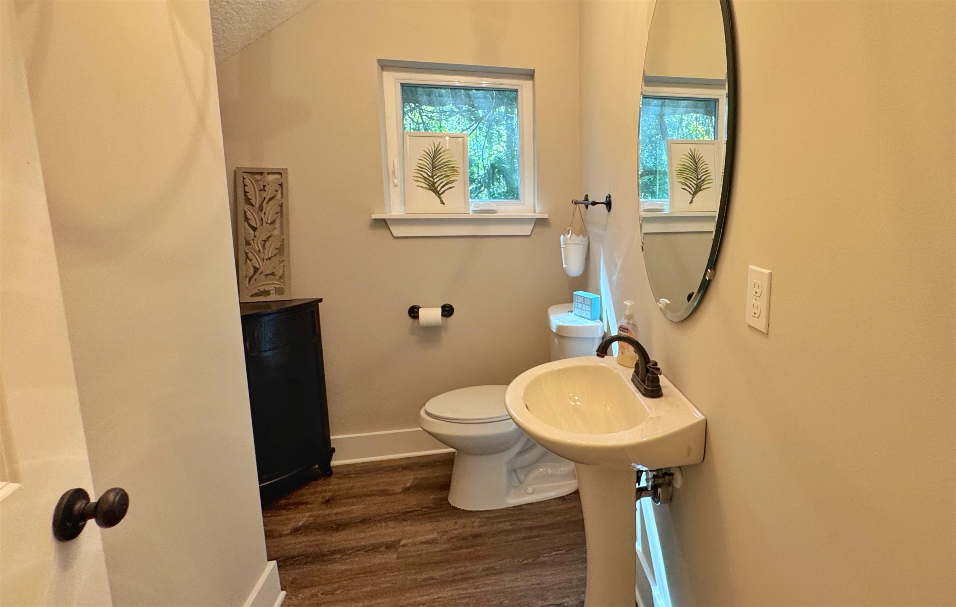2523 Oleander Street St. Augustine, FL 32080 - Photo 30 of 54 a bathroom with a sink toilet and a mirror