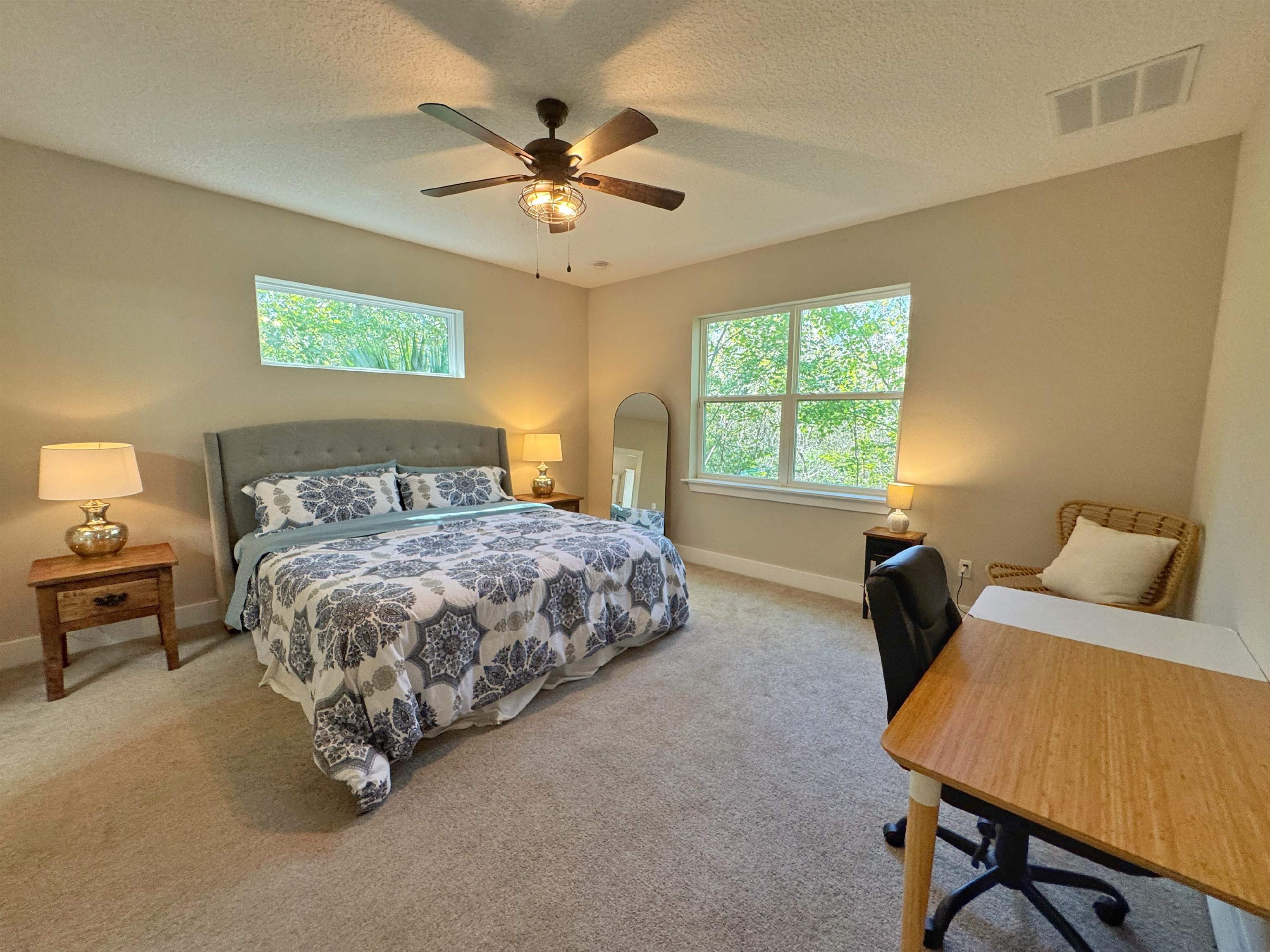 2523 Oleander Street St. Augustine, FL 32080 - Photo 31 of 54 a bedroom with a bed and a chandelier