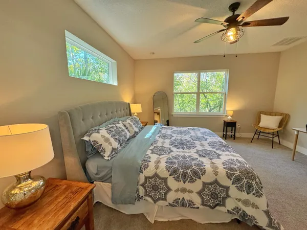 a bathroom with double vanity sink and a mirror