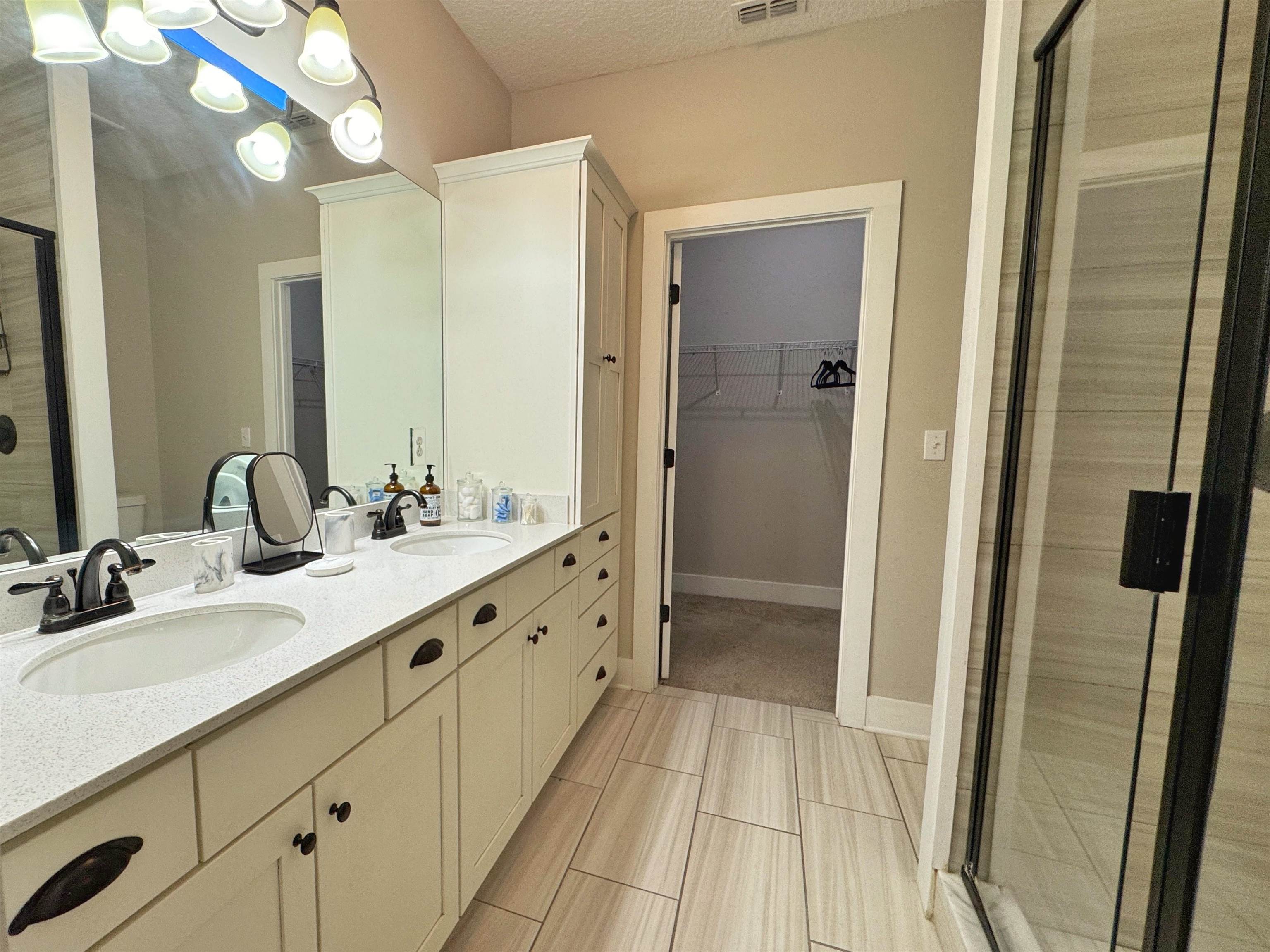 2523 Oleander Street St. Augustine, FL 32080 - Photo 35 of 54 a bathroom with double vanity sink and a mirror