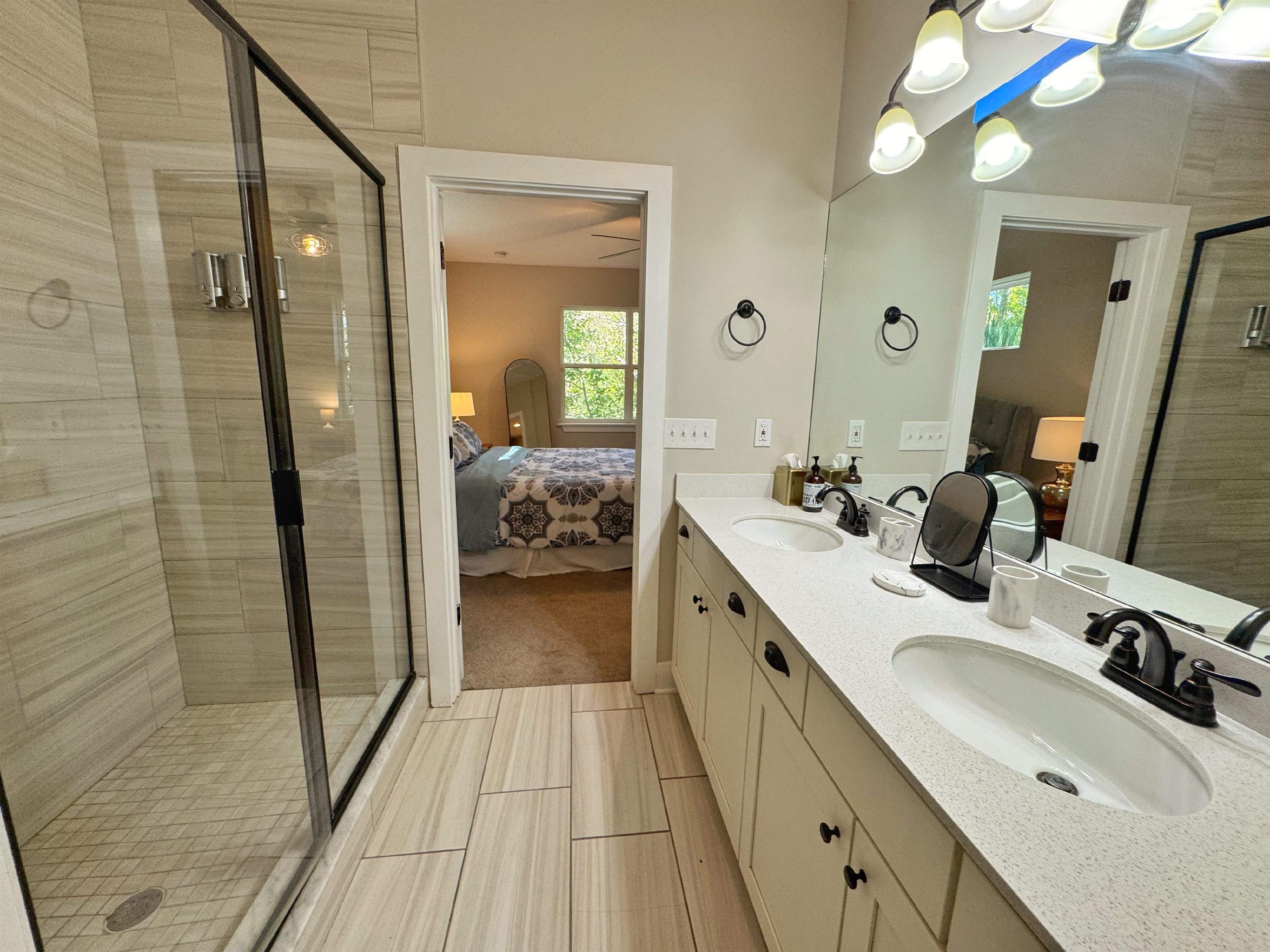 2523 Oleander Street St. Augustine, FL 32080 - Photo 38 of 54 a en suite bathroom with a sink double vanity and a mirror