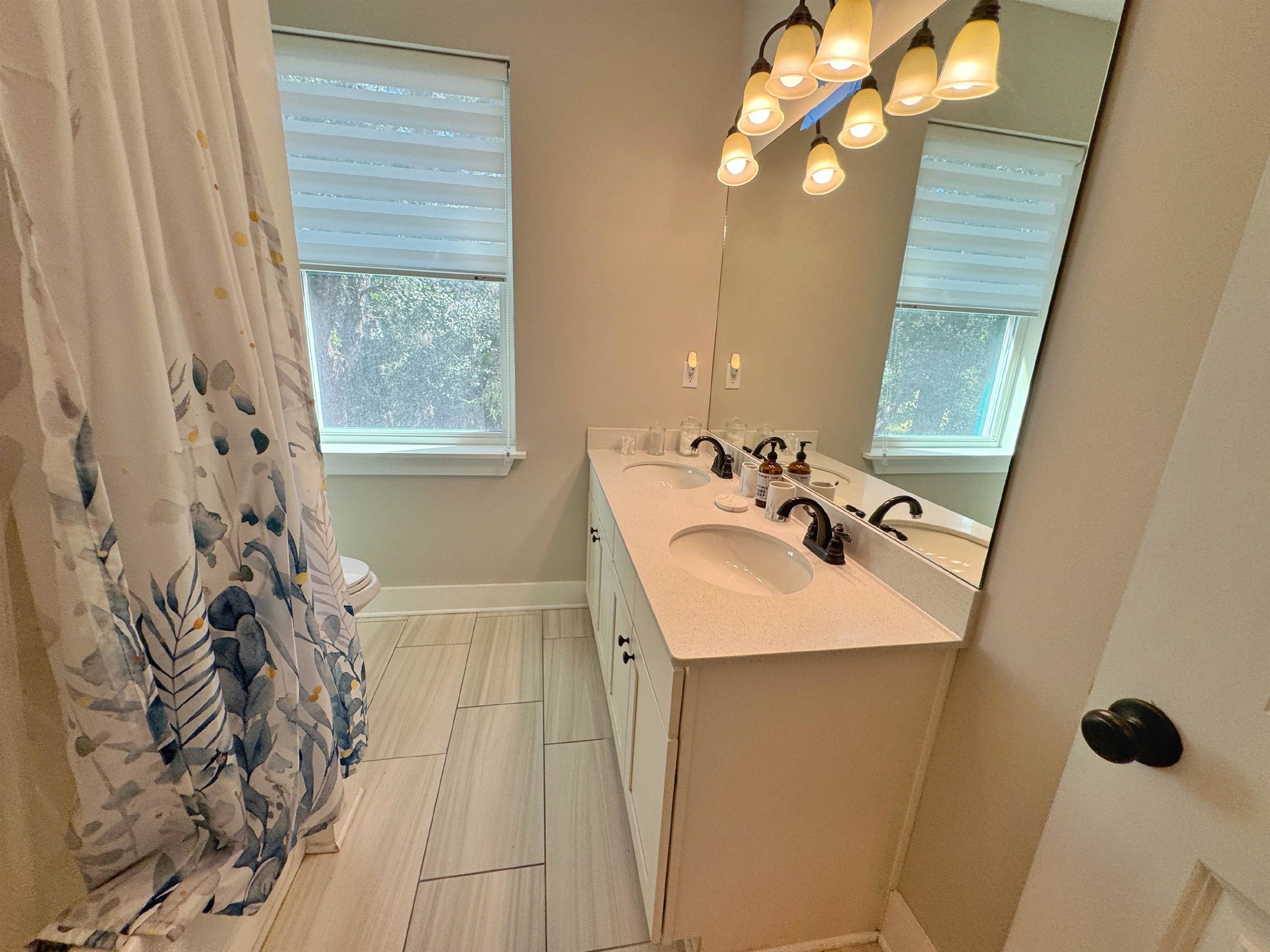 2523 Oleander Street St. Augustine, FL 32080 - Photo 39 of 54 a bathroom with a sink and a mirror