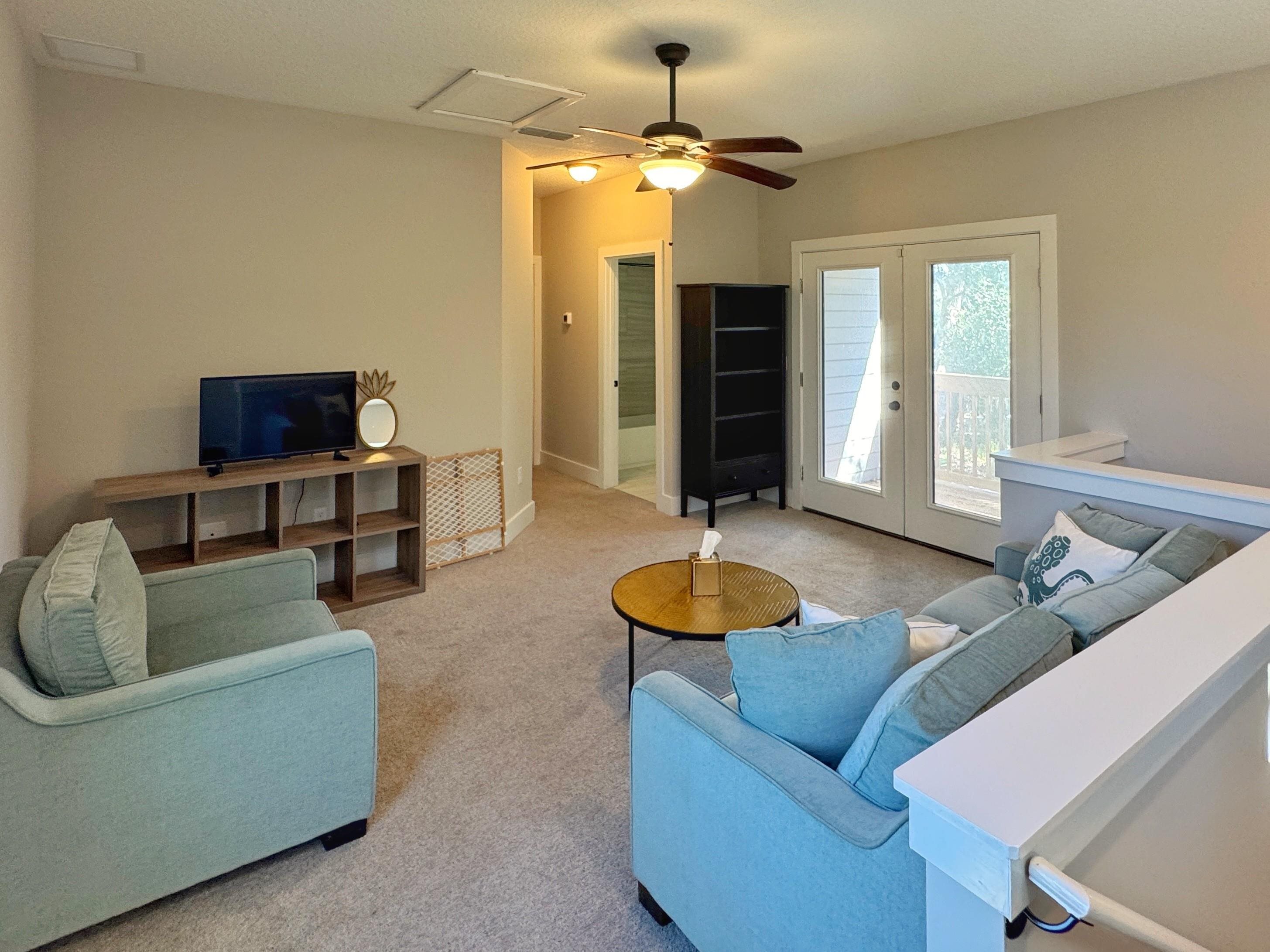 2523 Oleander Street St. Augustine, FL 32080 - Photo 43 of 54 a living room with furniture and a flat screen tv