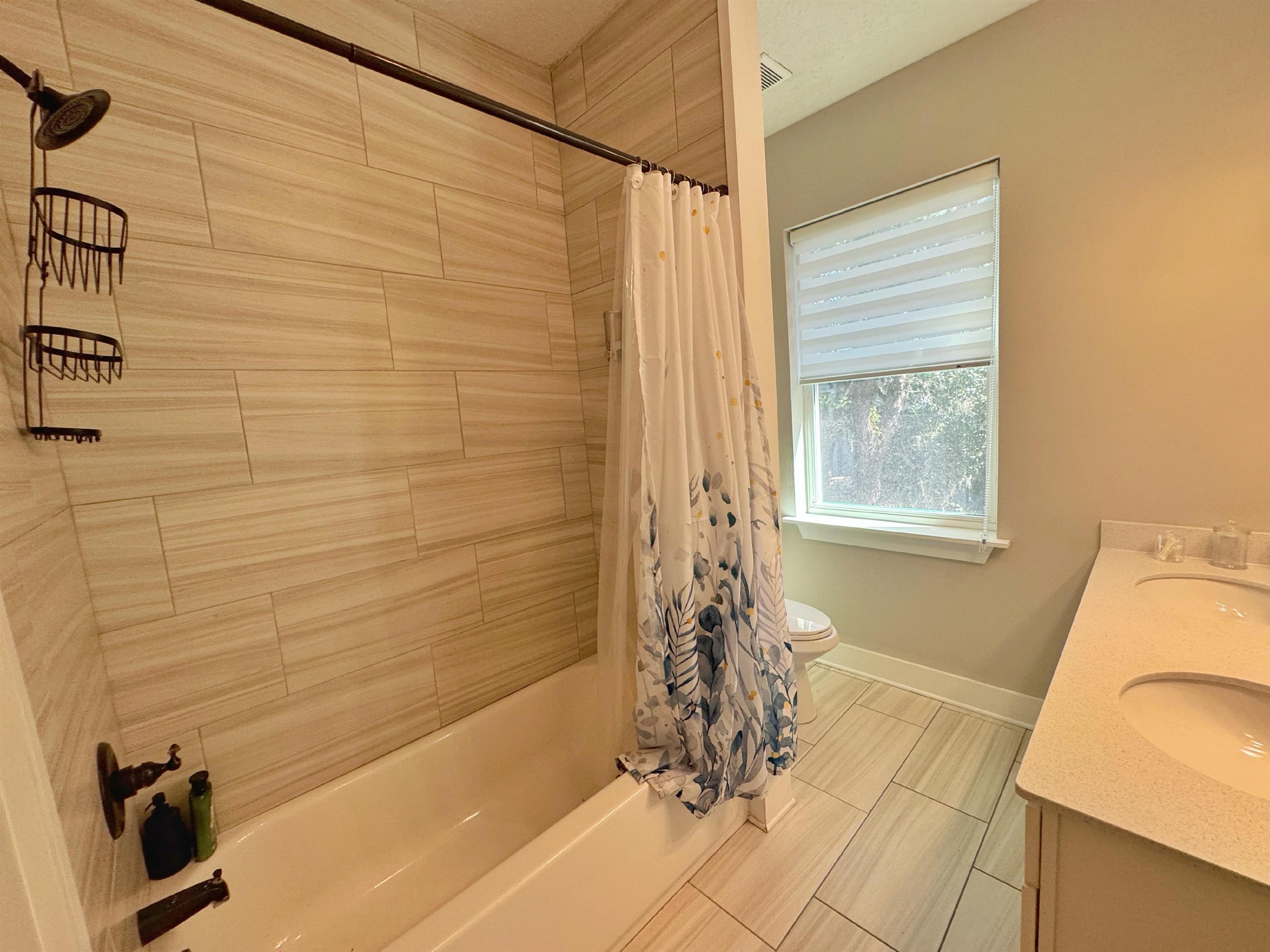 2523 Oleander Street St. Augustine, FL 32080 - Photo 47 of 54 a bathroom with a bathtub and shower