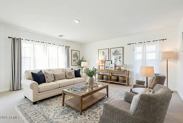 a living room with furniture and a couch