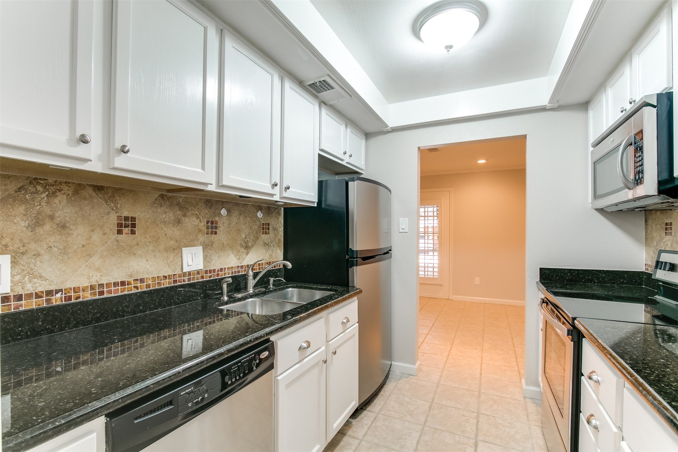1407 Springrock Lane Houston, TX 77055 - Photo 6 of 25 There's an abundance of space in the freshly painted cabinets to hold all of your dishes, serving pieces, gadgets and tools.