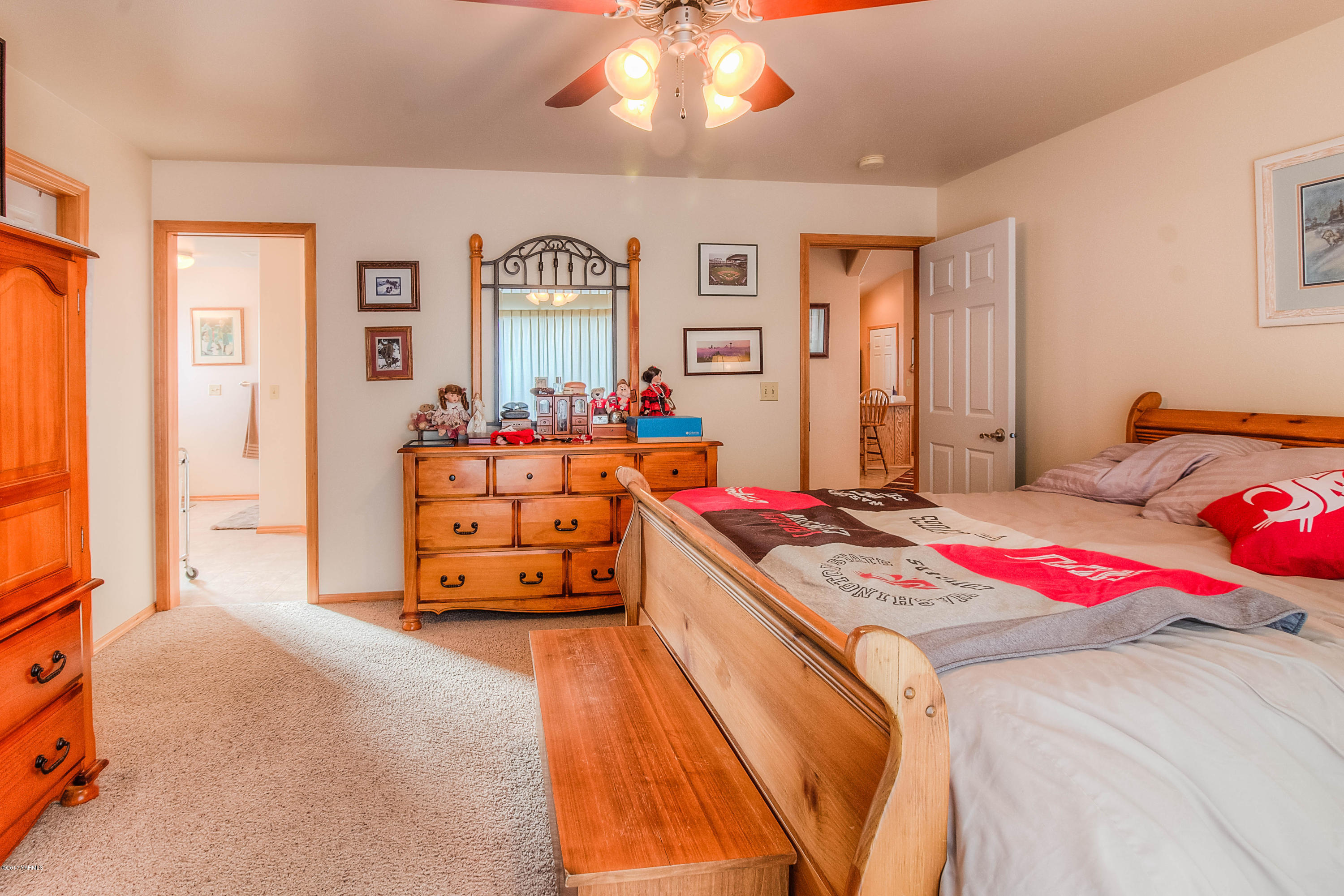 205 Beane Road Moxee, WA 98936 - Photo 14 of 28 a bedroom with a bed and wooden floor