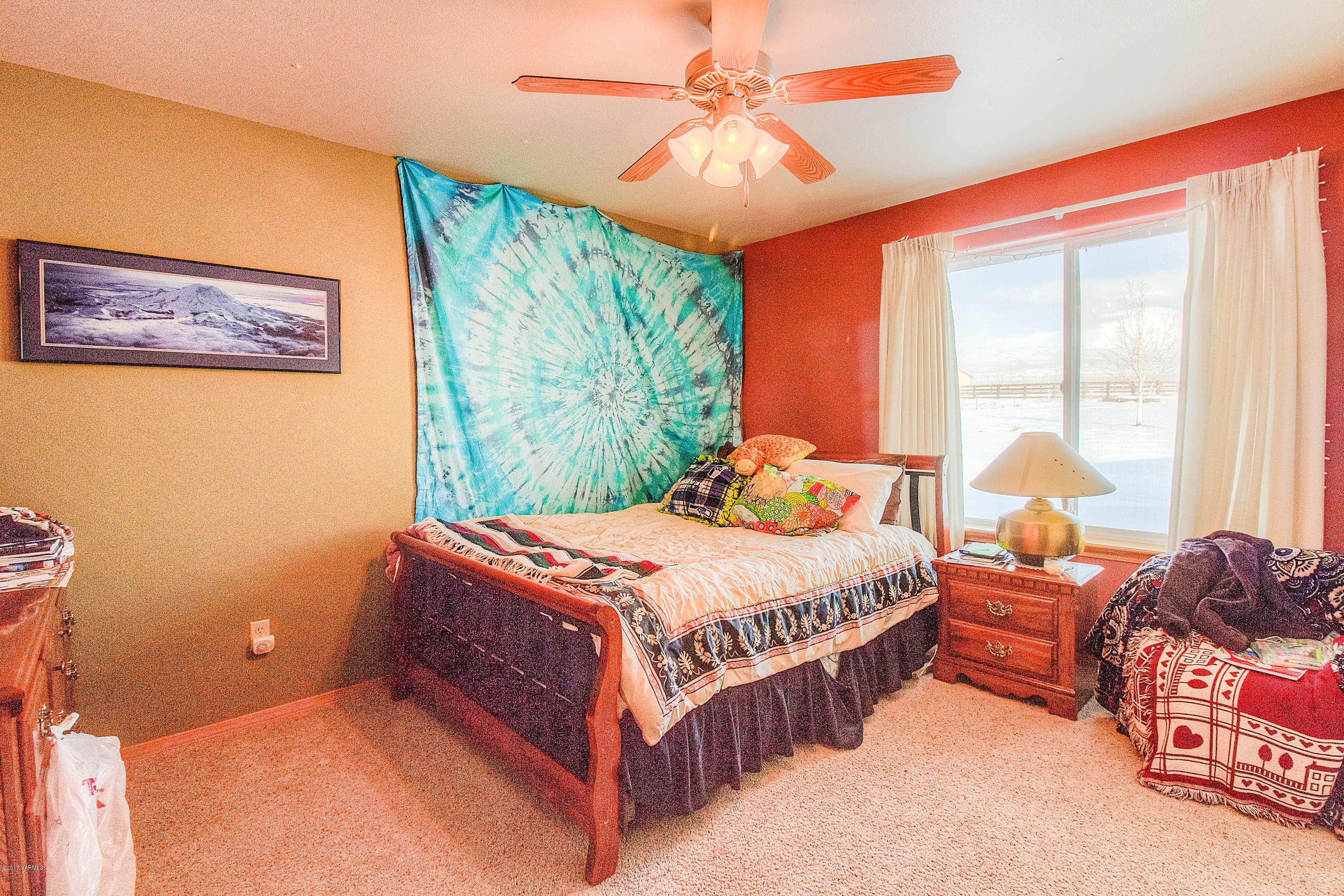 205 Beane Road Moxee, WA 98936 - Photo 21 of 28 a bed sitting in a bedroom next to a window
